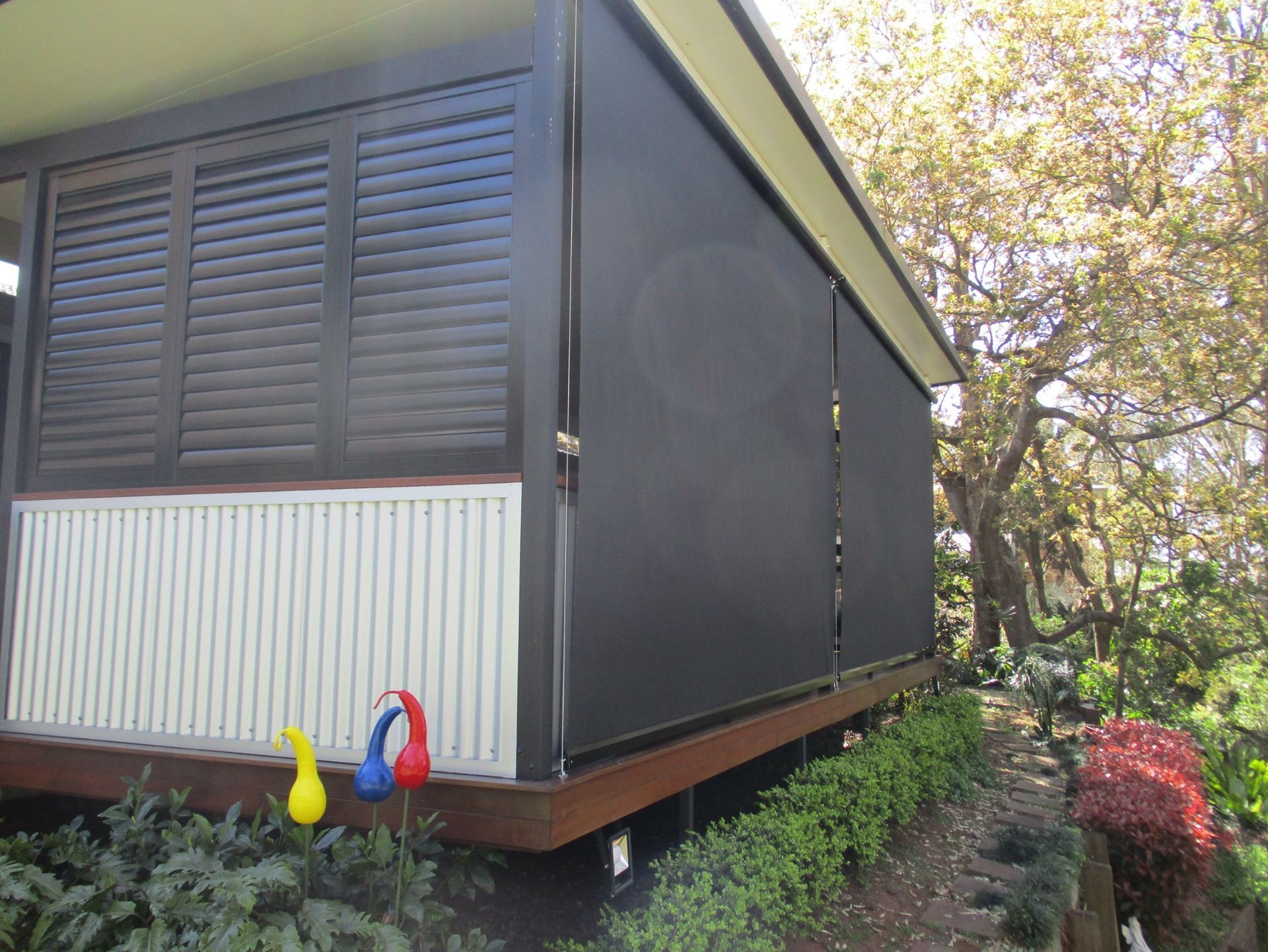 Exterior View of a House With Black Sun Screens and Shutters — Toowoomba Shade & Canvas in Dalby, QLD