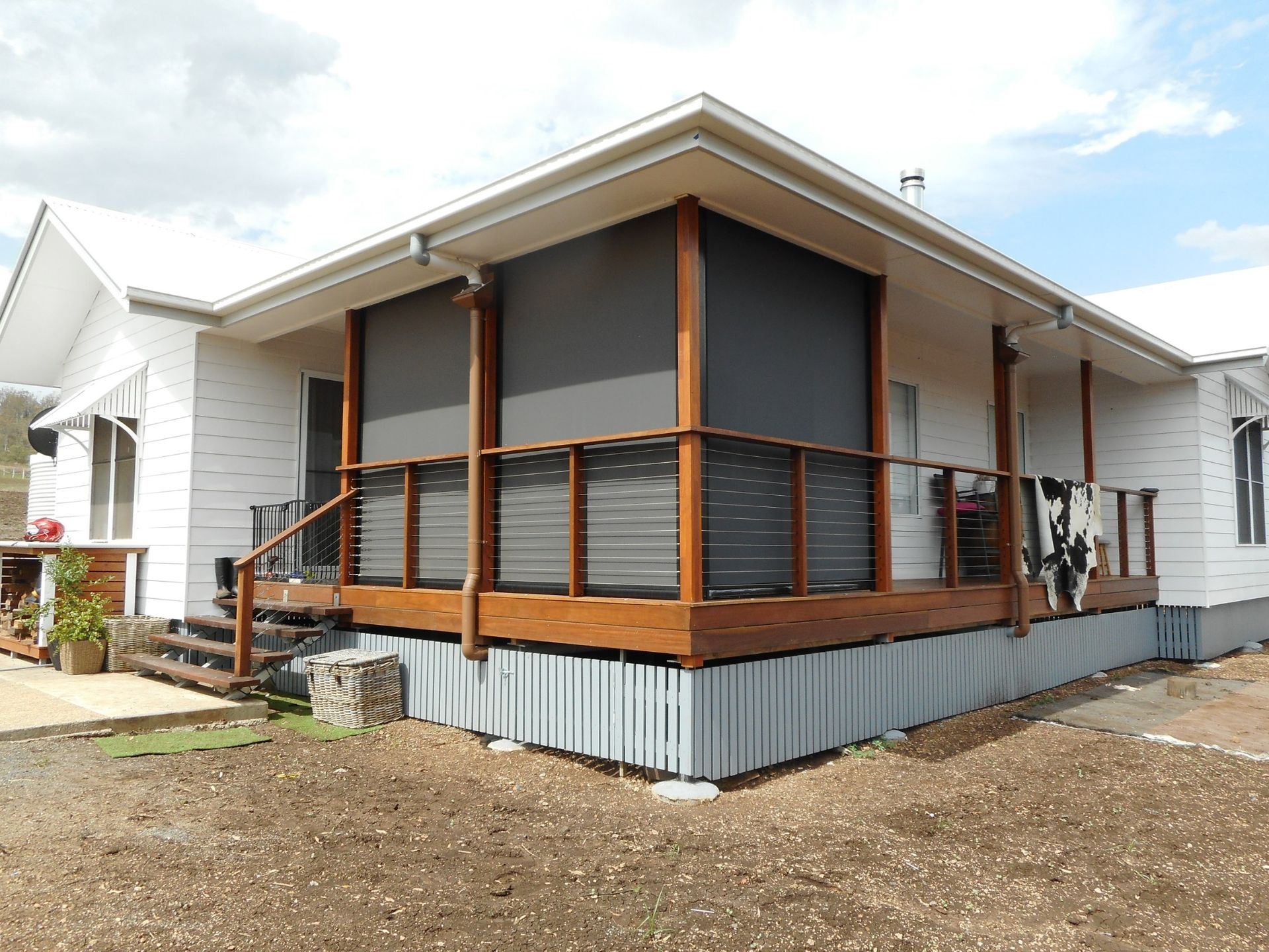 White House With Wooden Deck, Dark Gray Shades ā Toowoomba Shade & Canvas in Harristown, QLD