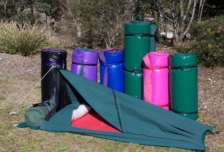 Green Tent With Open Entrance, Various Colored, Rolled Sleeping Pads — Toowoomba Shade & Canvas in Harristown, QLD