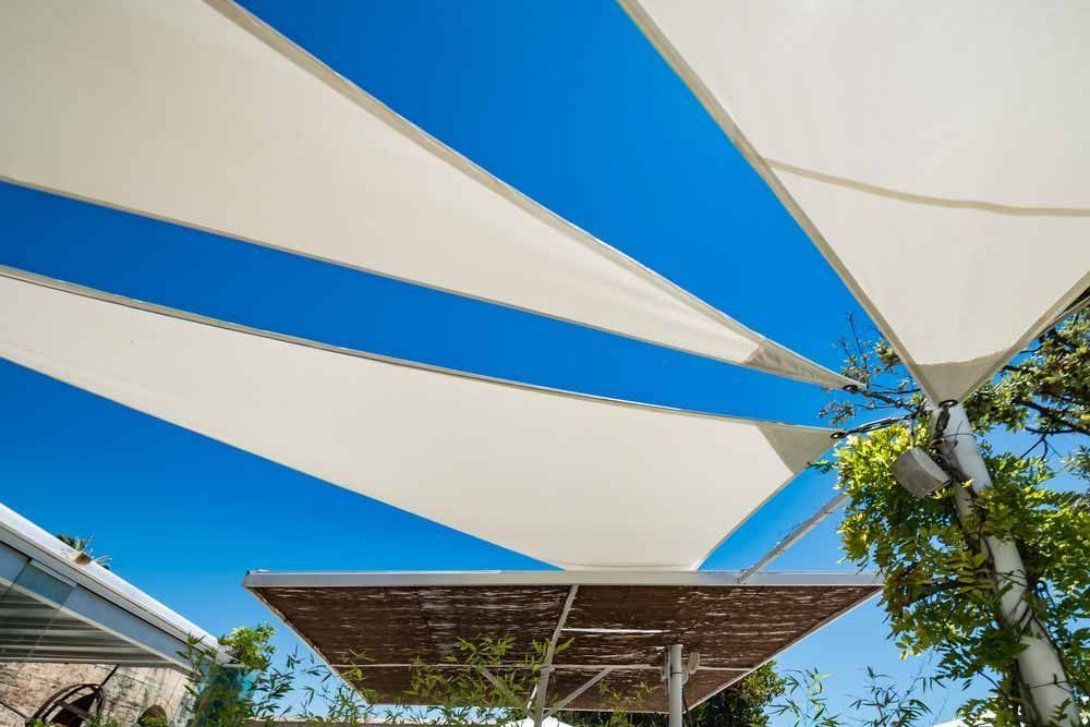 White Shade Sails Against a Bright Blue Sky — Toowoomba Shade & Canvas in Harristown, QLD