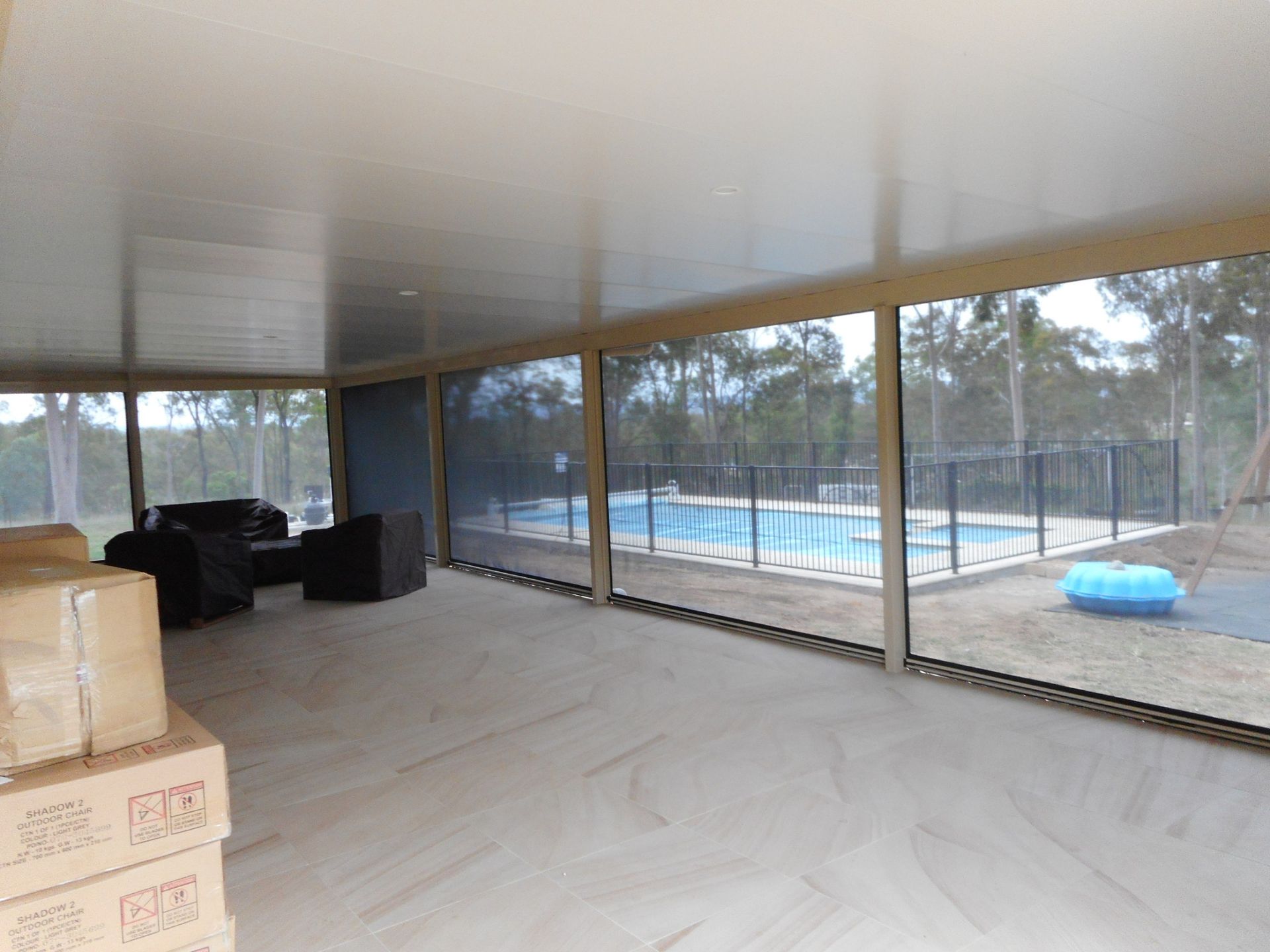 Covered Patio With Pool View, Wood Floor, Screen Windows — Toowoomba Shade & Canvas in Harristown, QLD