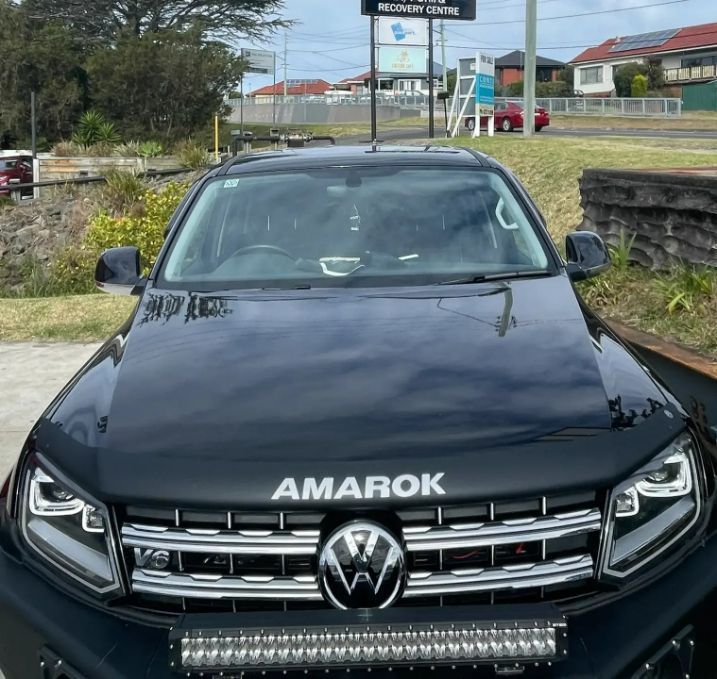 A Black Amarok Is Parked On The Side Of The Road — Dunhams Auto Repairs In Woonona, NSW