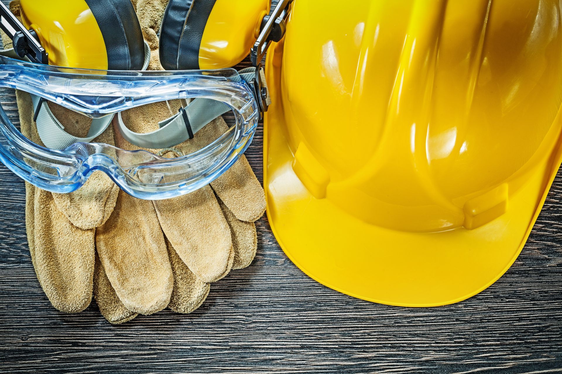 Chef wearing white apron and shirt, two pens in apron pocket.