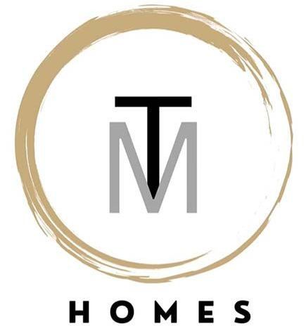 a logo for homes with a letter m in a circle .