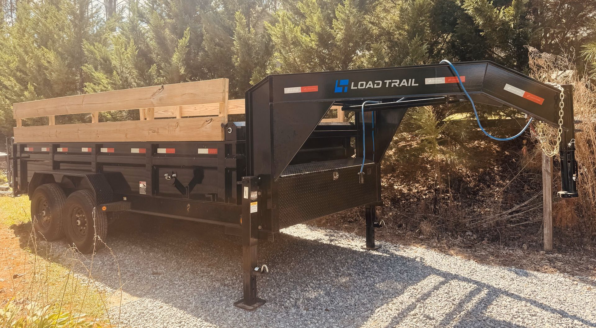 A black trailer with the word gator on the side