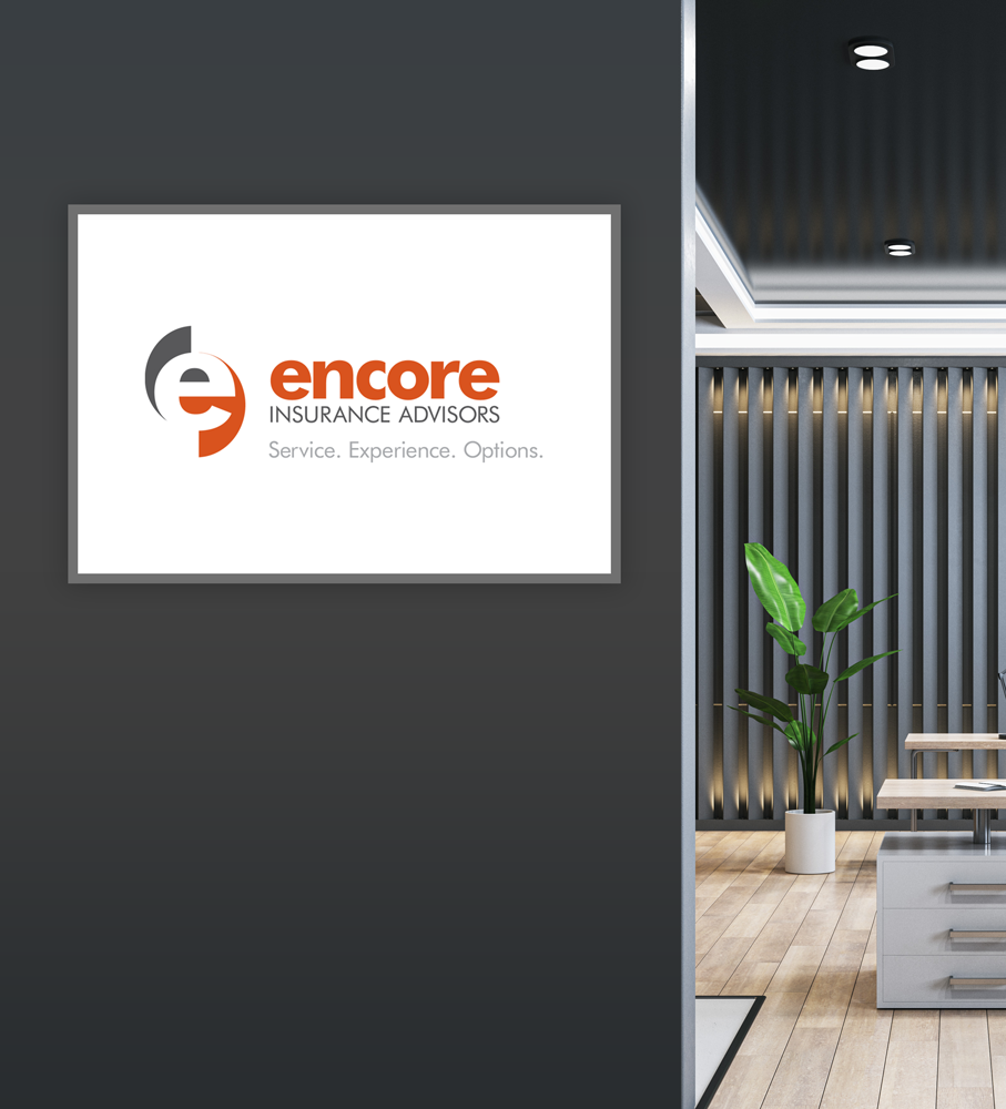 Logo of Encore Insurance Advisors displayed on a dark gray wall, with a glimpse of a modern office interior.