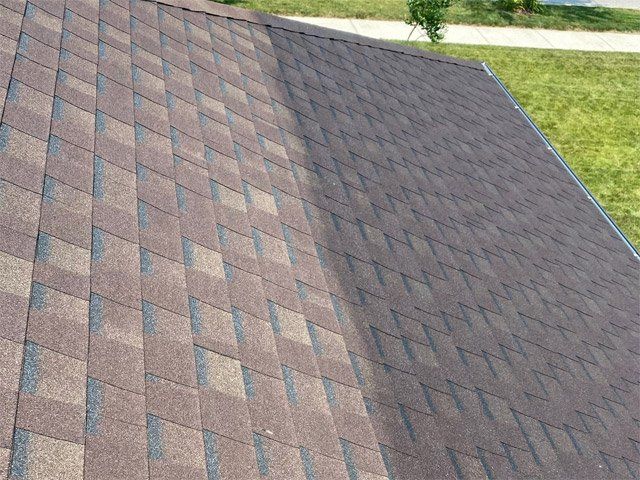 A close up of a roof with shingles on it