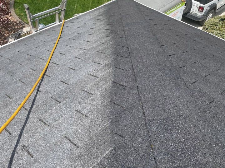 A black roof with a yellow hose attached to it.