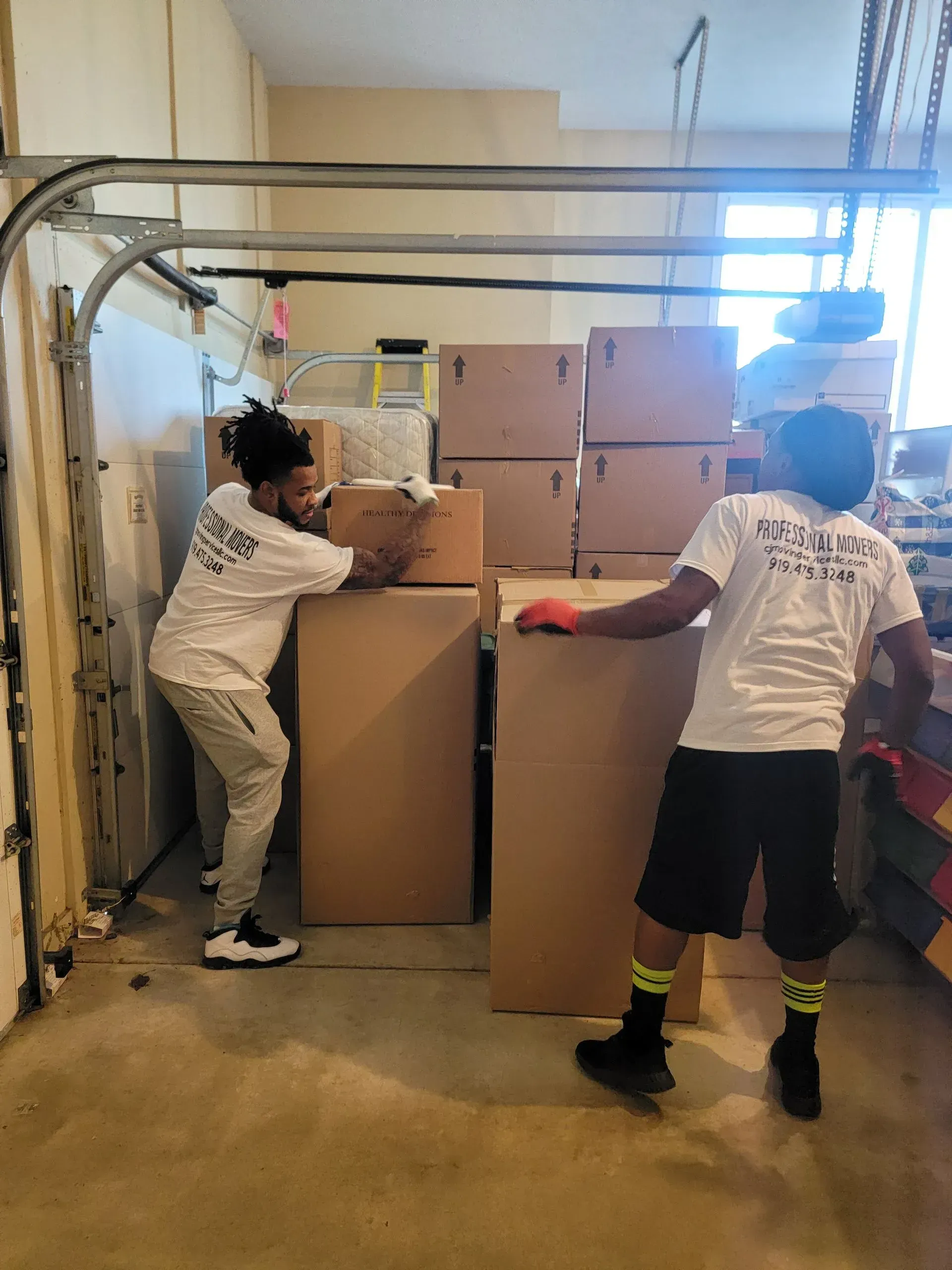 Employees moving boxes