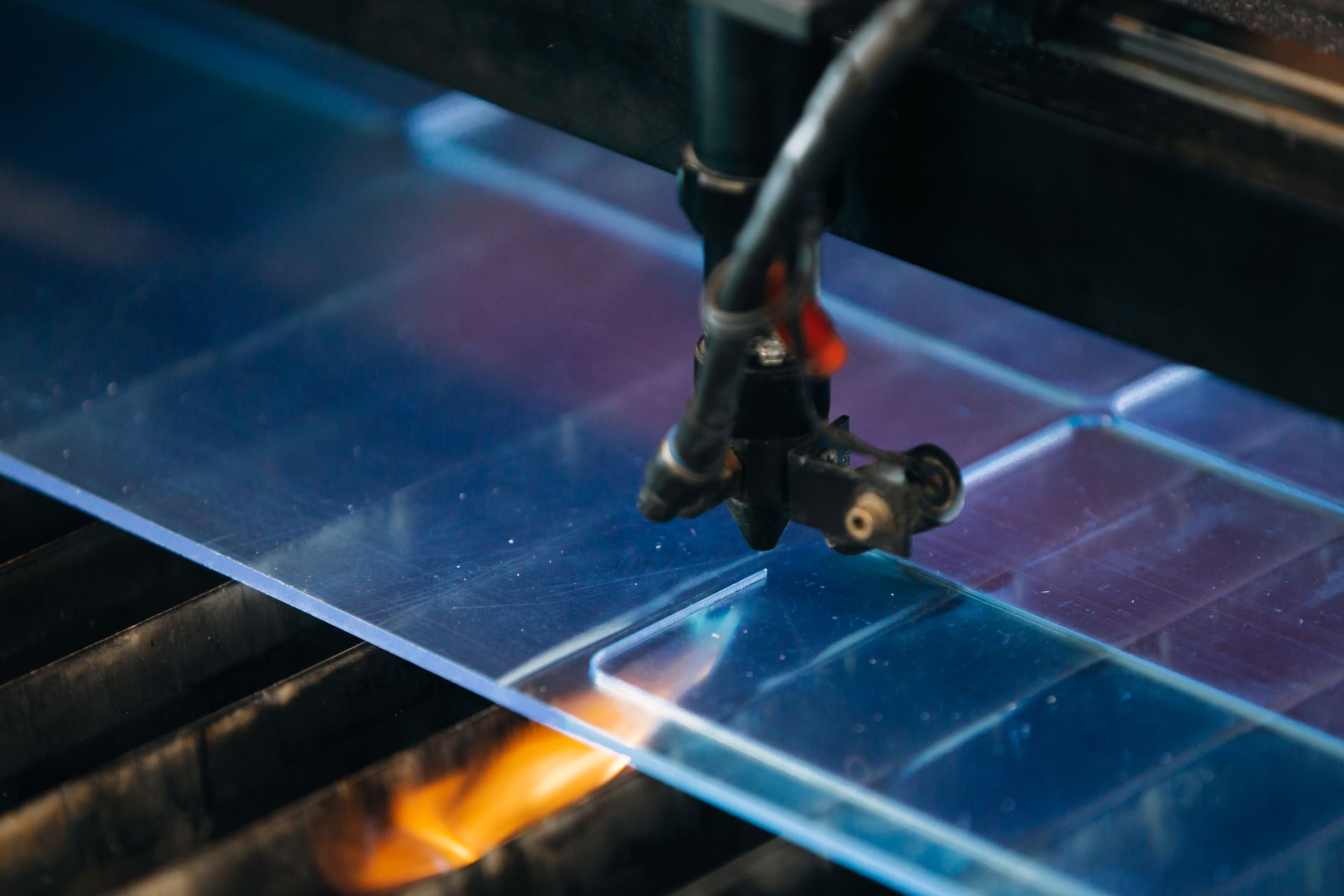 Laser cutting machine cutting a plastic material.