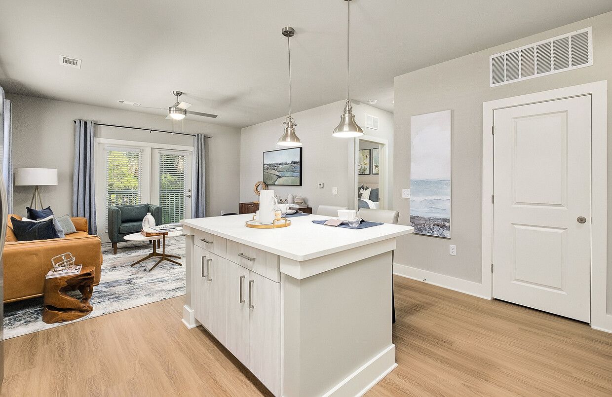 A living room with a large island in the middle of it.