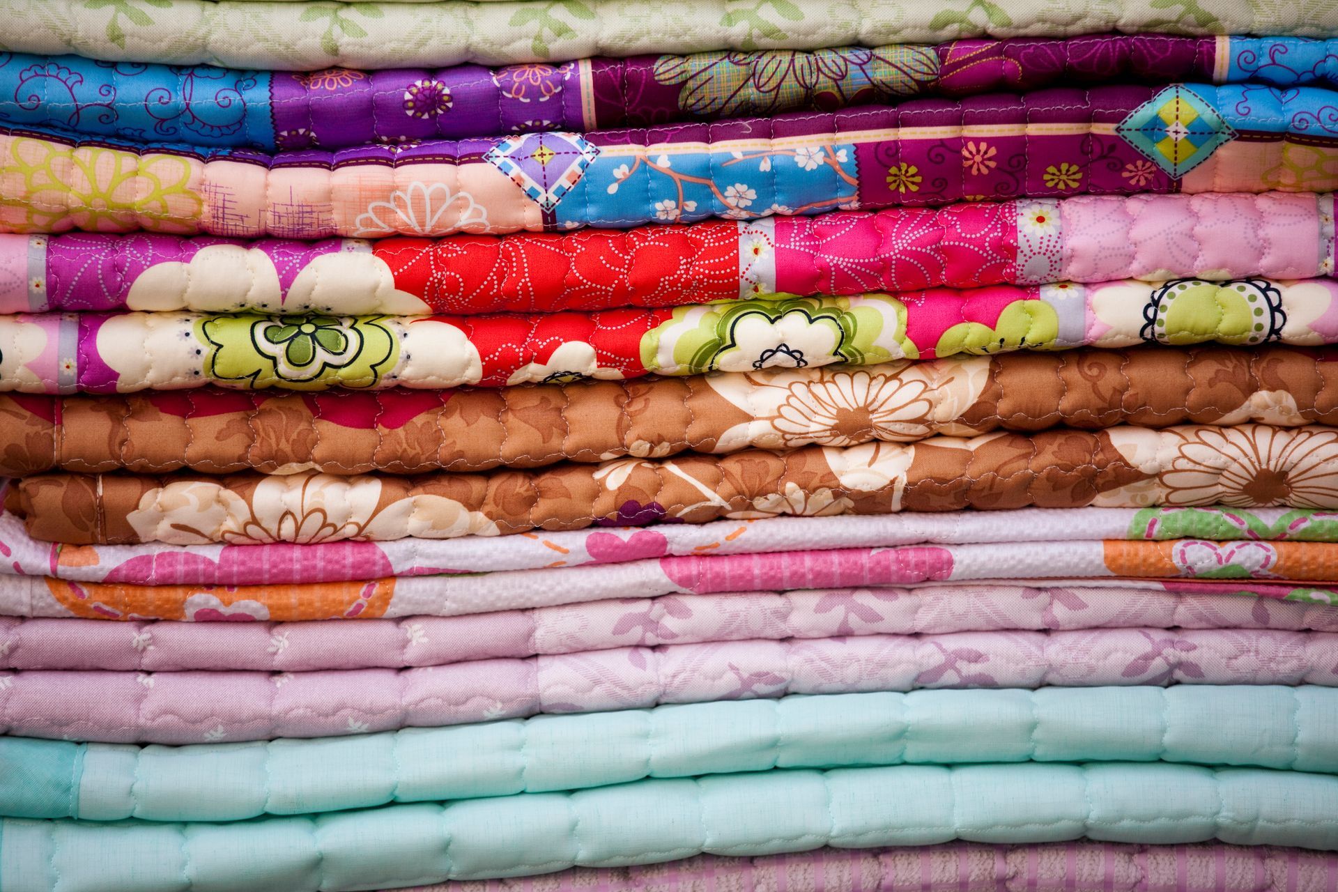 Stacks of bedding quilt fabric.