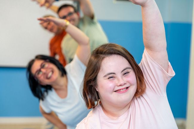 A group of people are doing yoga together.
