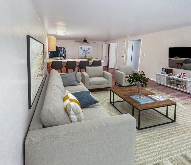 Photo of a living room with a barstool area separating the living room and the kitchen