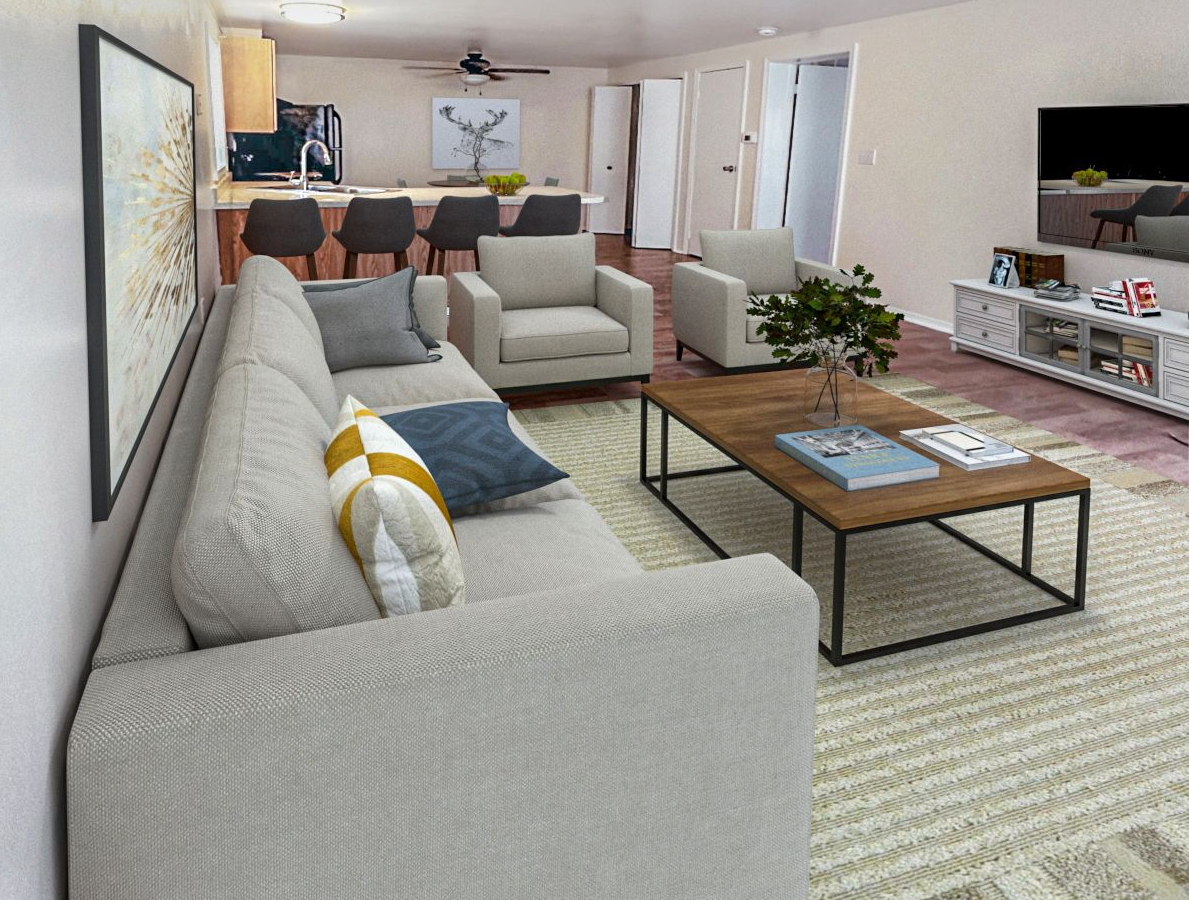 Photo of a living room with a kitchen in the background
