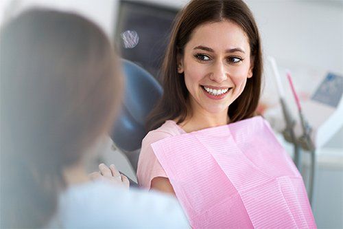 Patient Talking To Dentist