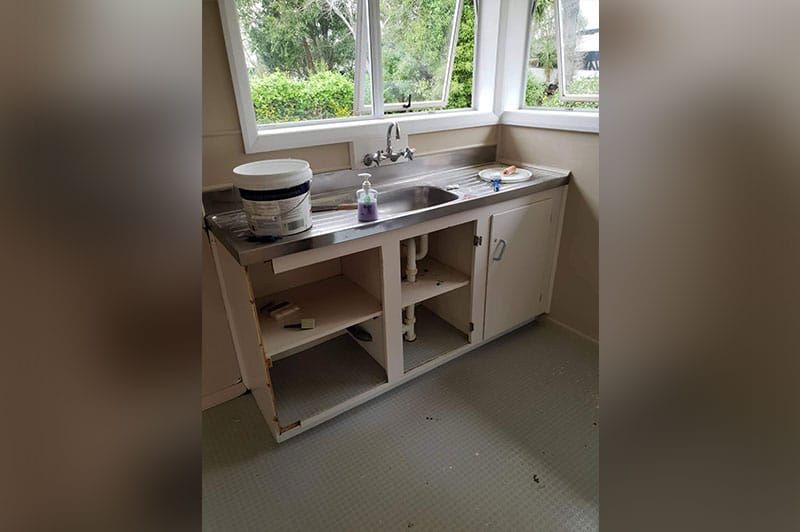 Water Sink With A Small Pale On The Corner – Hamilton, NZ – Jamark Plumbing