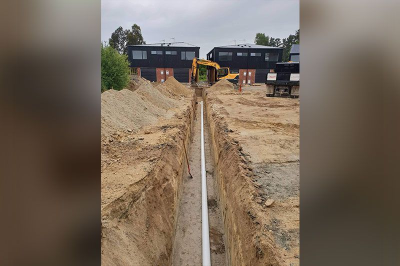 White Tube Going Over A Borough – Hamilton, NZ – Jamark Plumbing