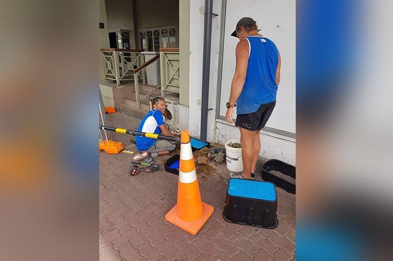 2 Man On A Blue Shirt And A Cone Head On The Center – Hamilton, NZ – Jamark Plumbing