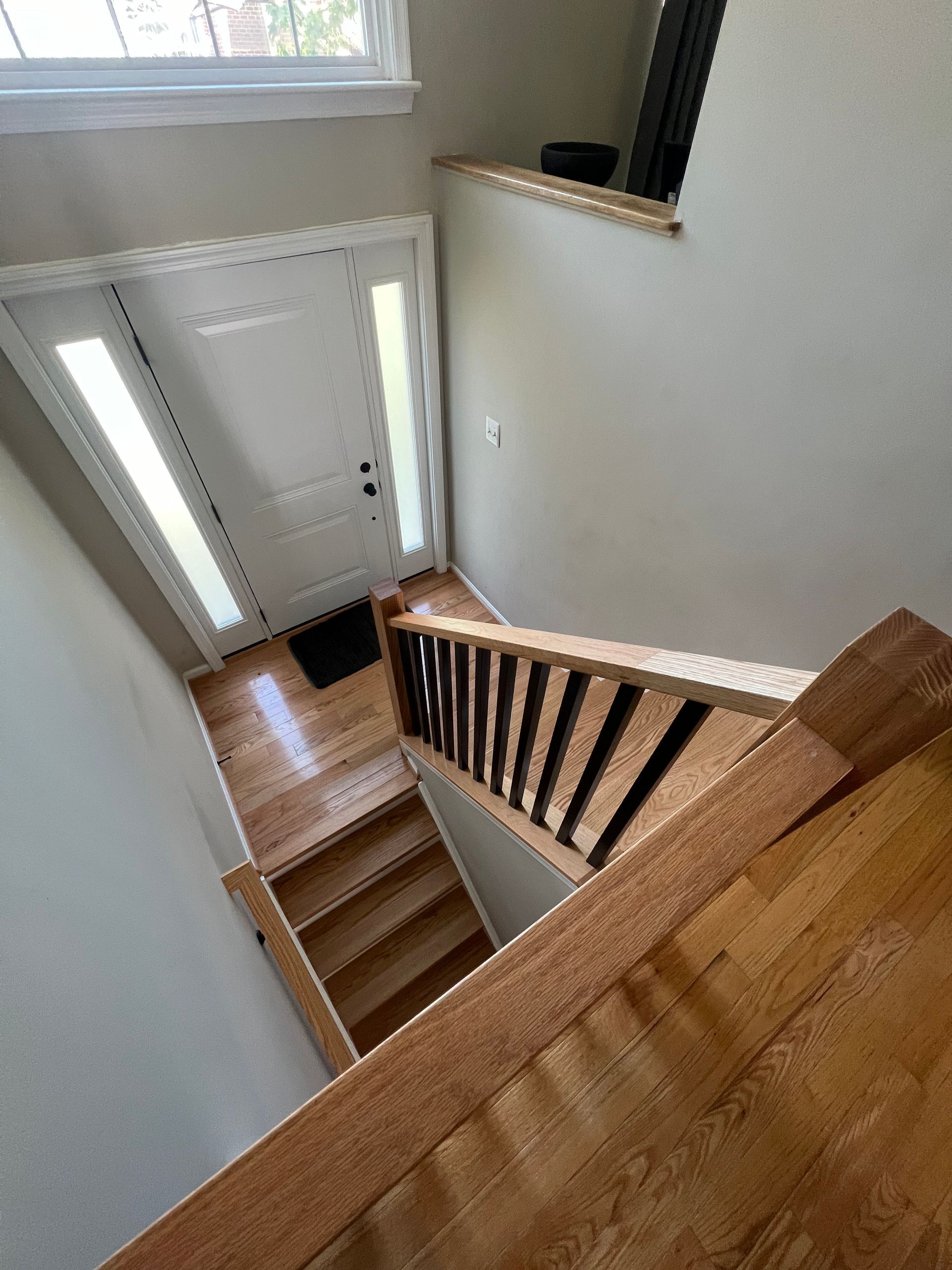 A view of a staircase leading up to the second floor of a house.