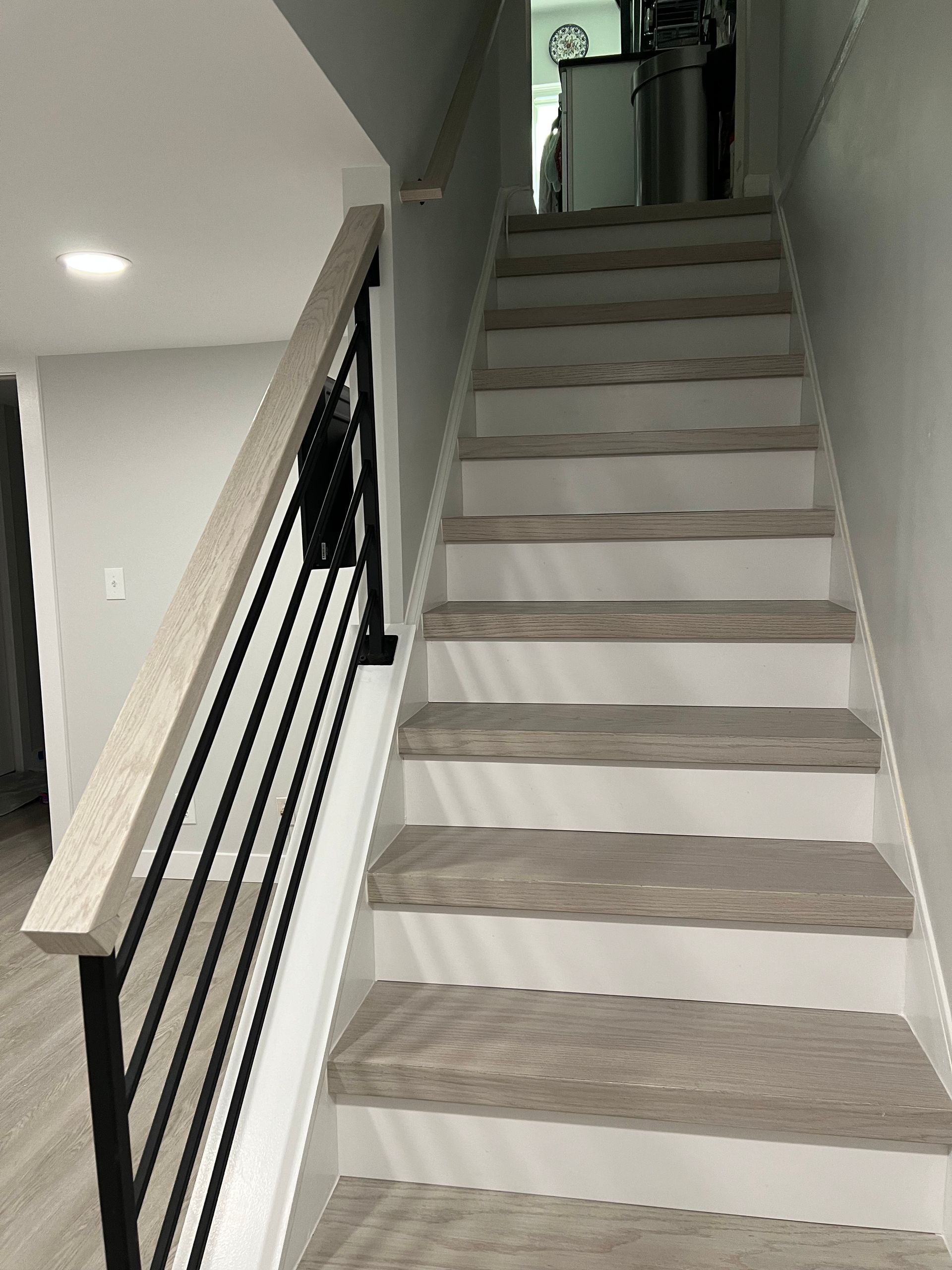 A set of stairs leading up to the second floor of a house.