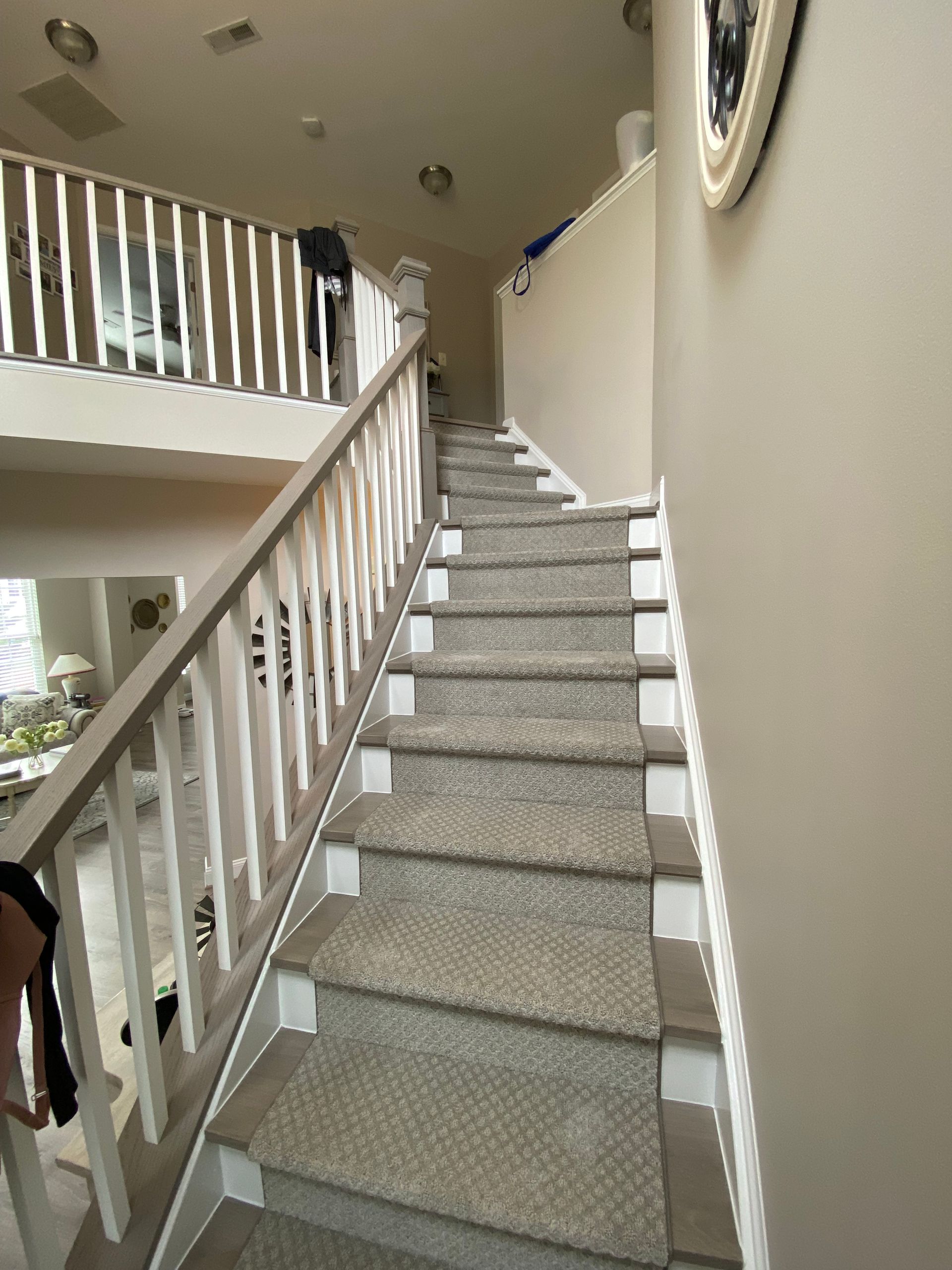 A set of stairs leading up to a second floor in a house.