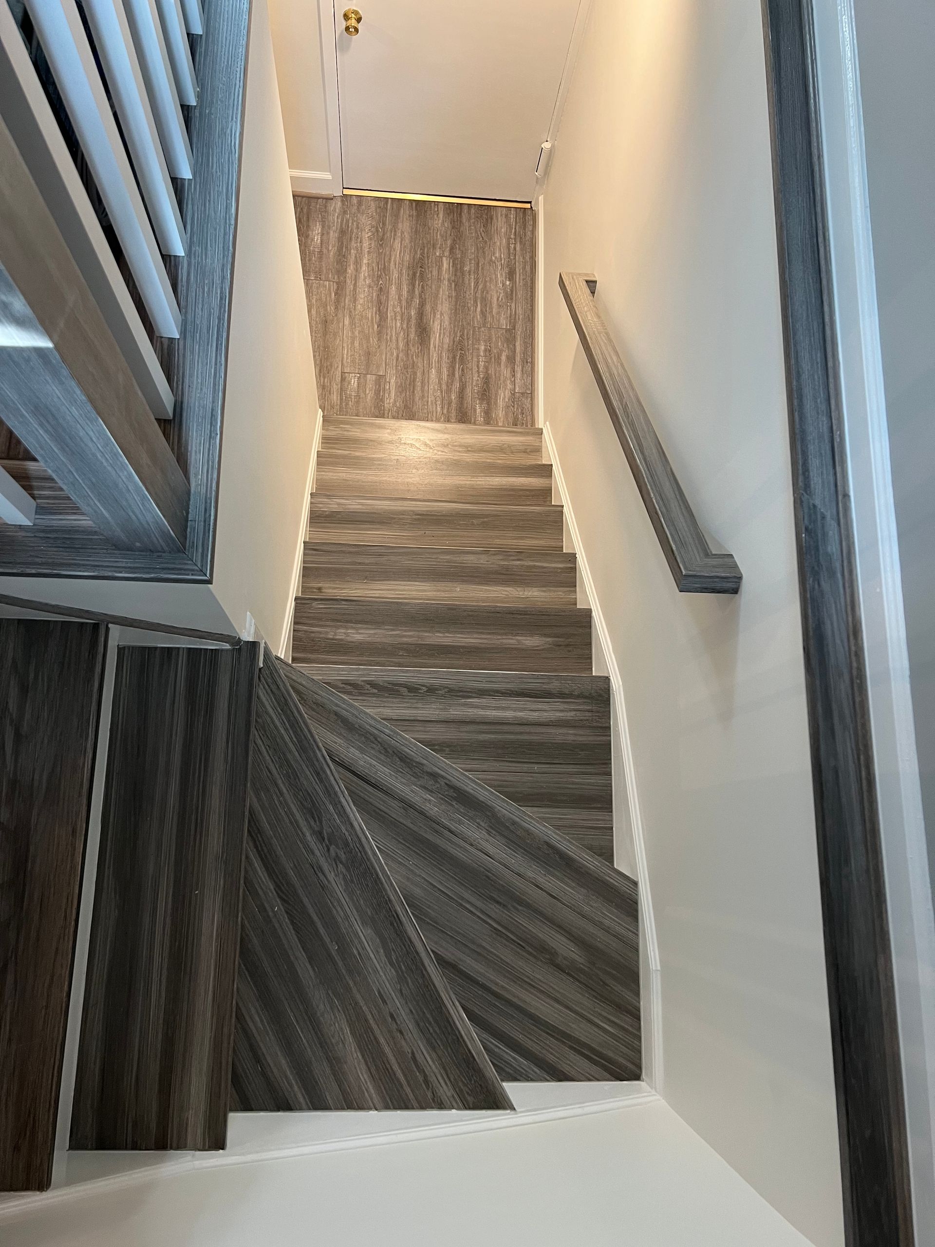 A set of stairs leading up to a second floor in a house.