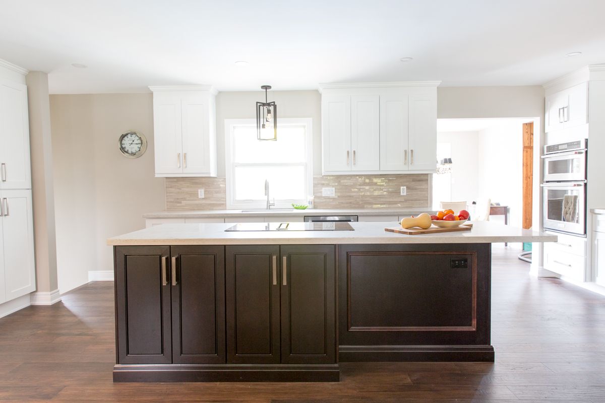There is a large island in the middle of the kitchen.