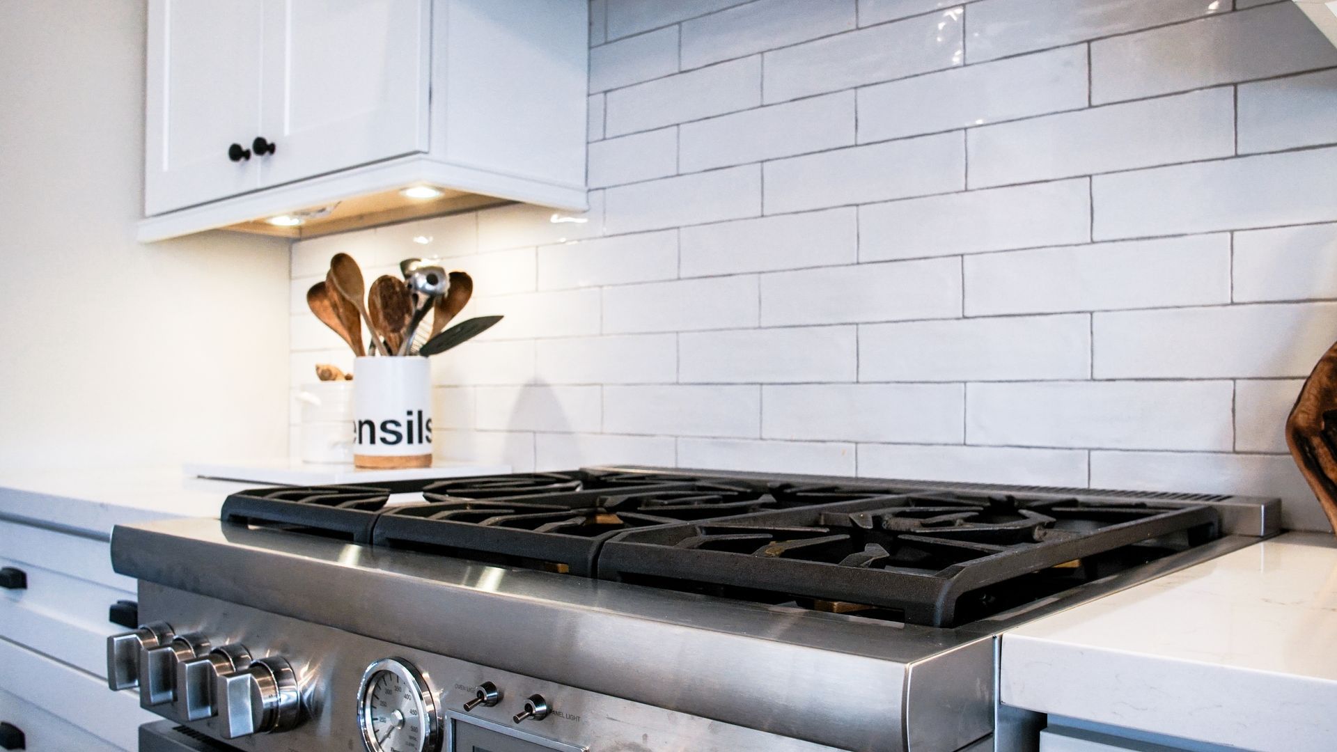 A stove top oven is sitting on top of a counter in a kitchen.