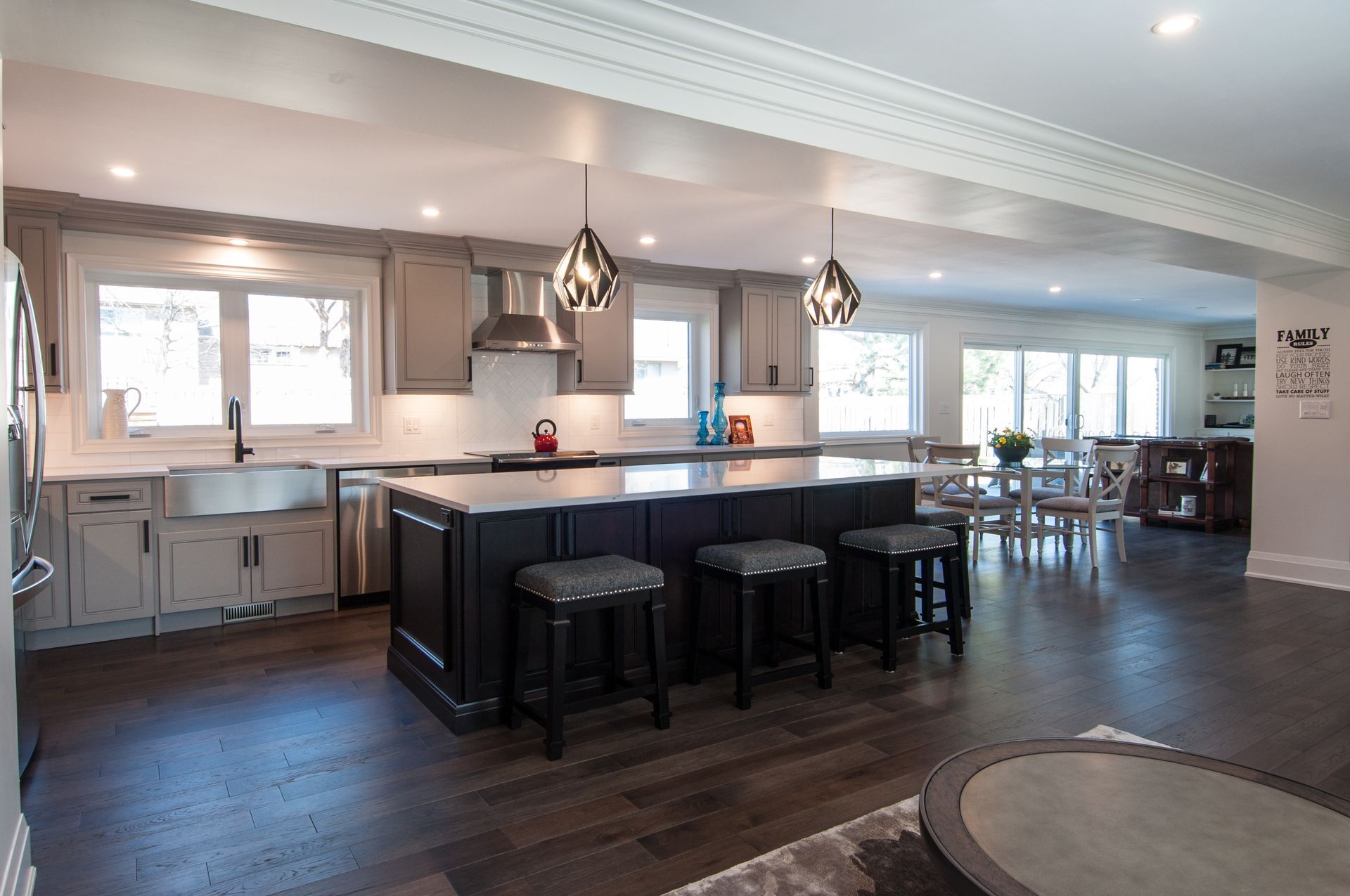 A large kitchen with a large island and stools