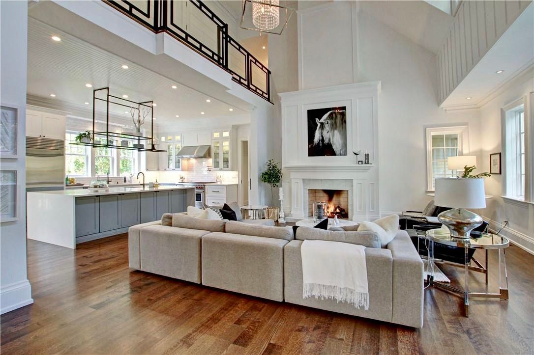 A living room with a couch and a fireplace in a house.