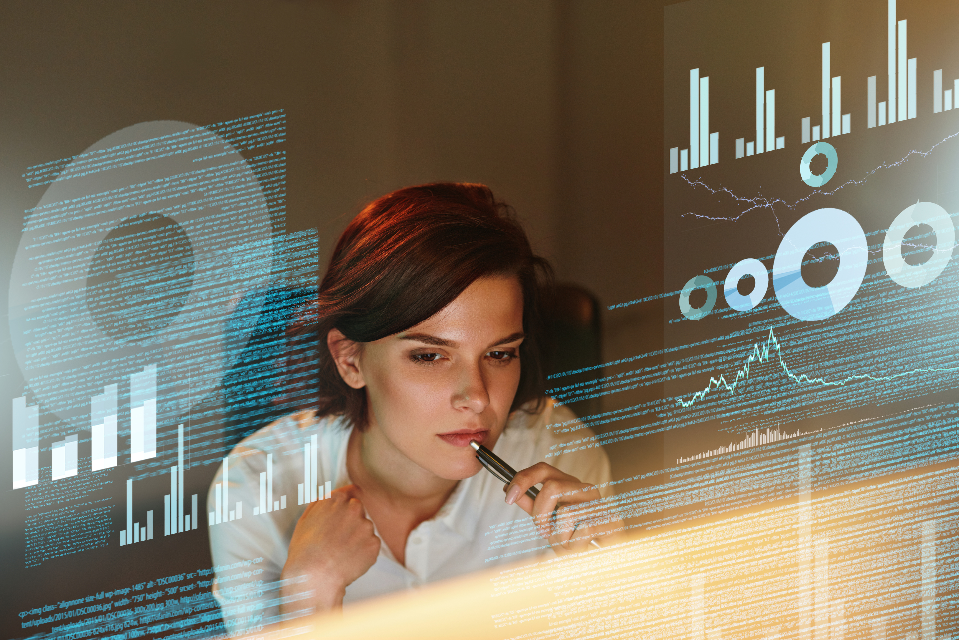 Woman in white shirt studying data visualizations on screen, thoughtful expression.