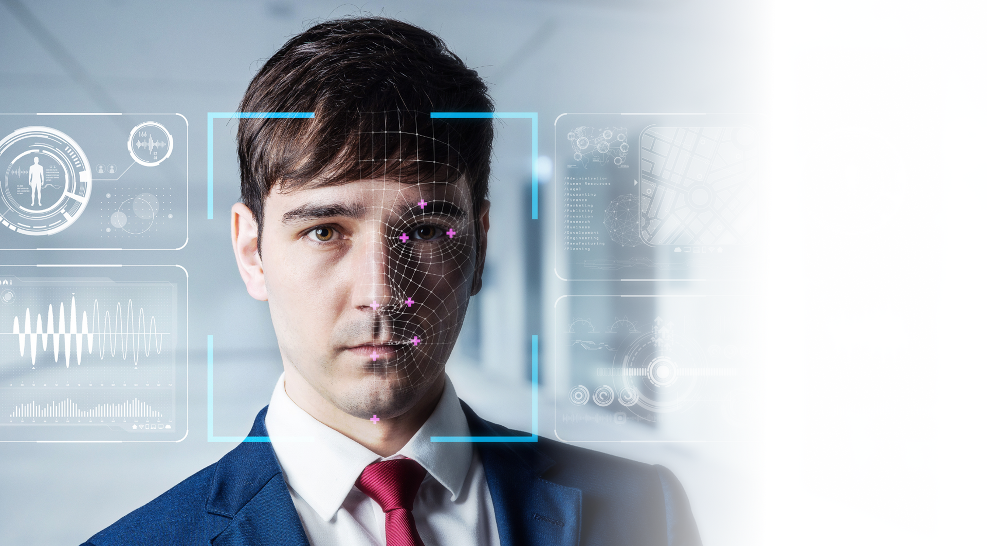Man in suit with face scan overlay, in an office setting.