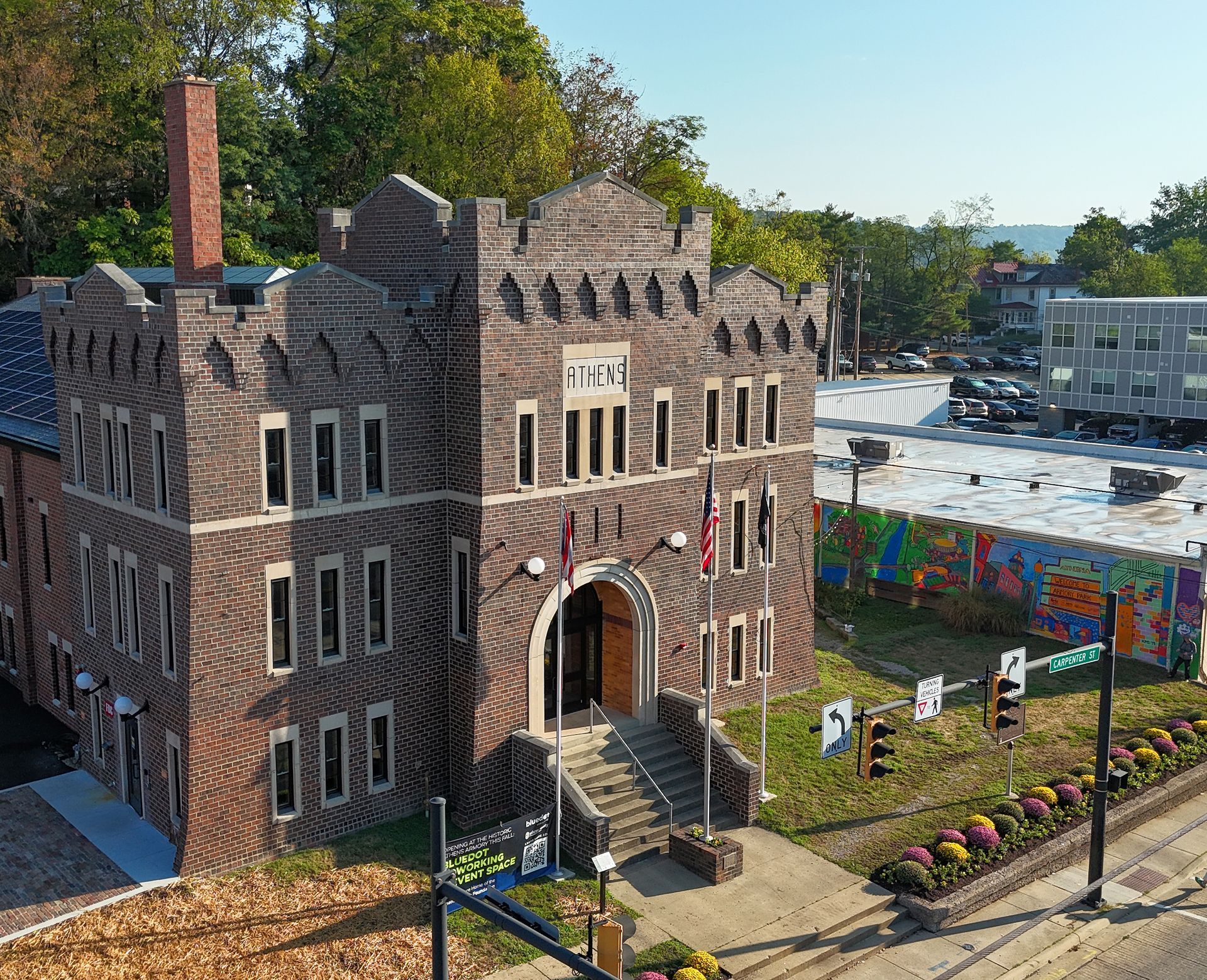 Athens Armory building flag visible. Sunny outdoor setting. Armory Park