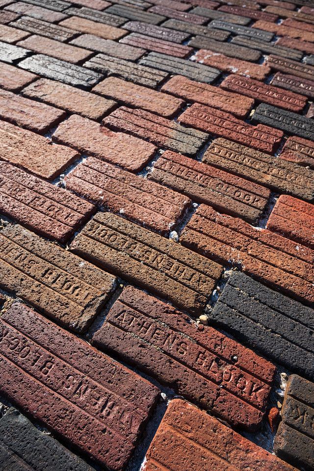 A close up of a street in Athens with Athens Block bricks pavement