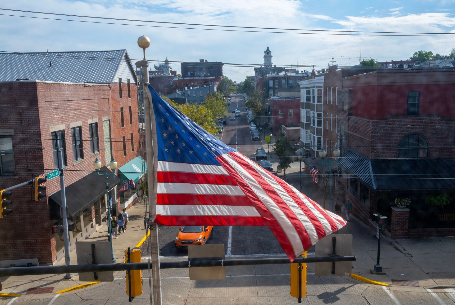 View of Court Street downtown Athens behind the US flag