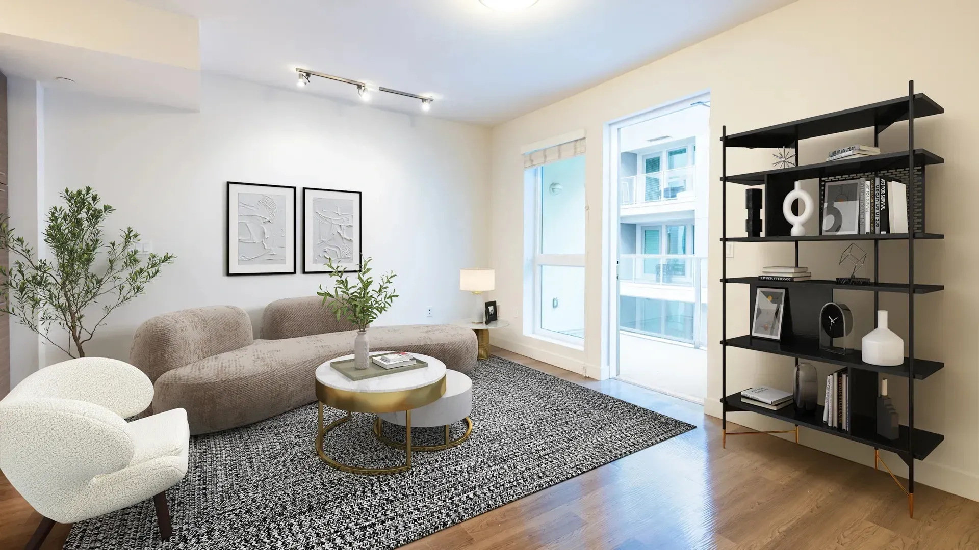 Modern living room with a curved sofa, accent chair, and a black shelving unit.