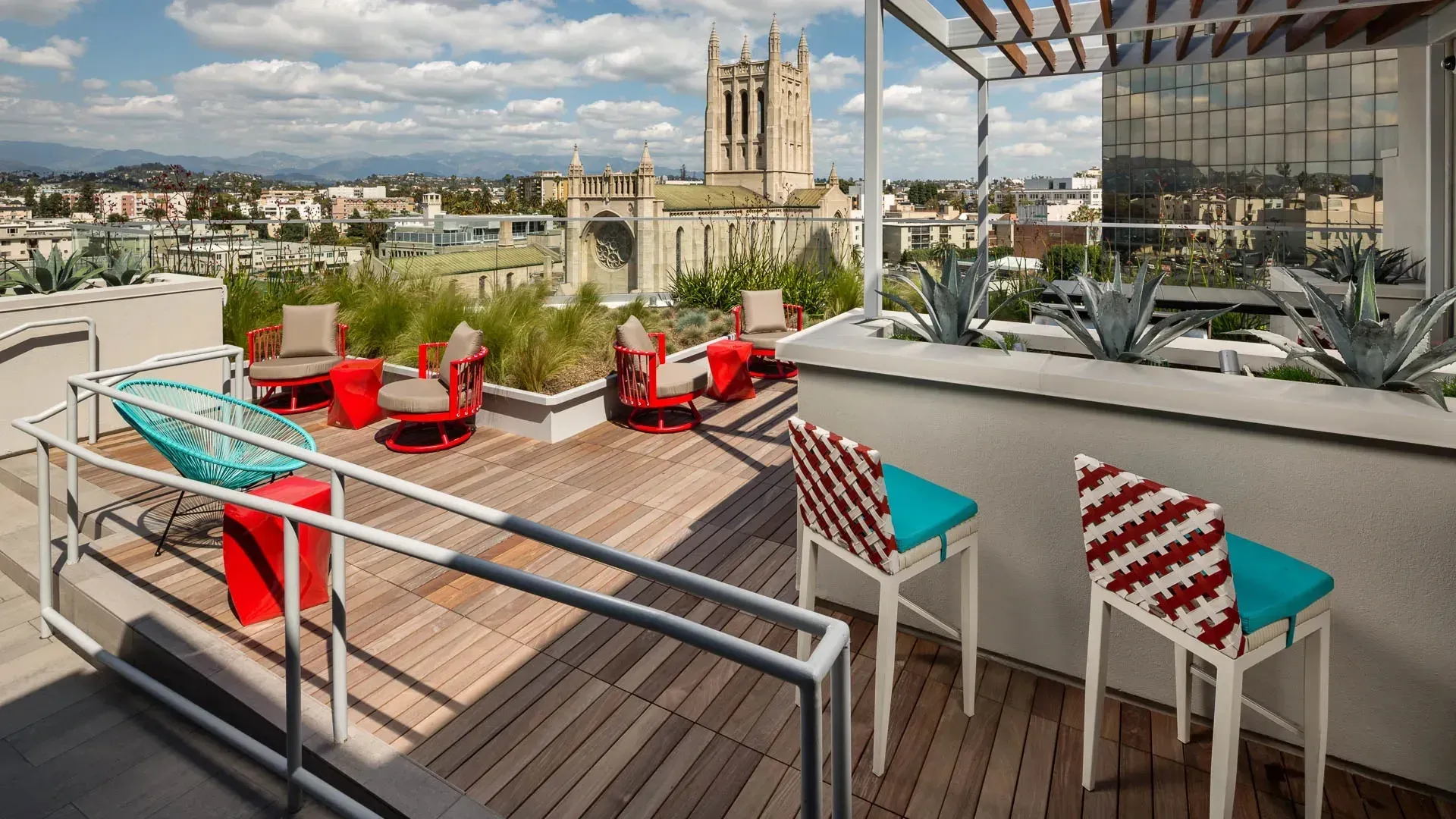 Rooftop terrace with seating and city views