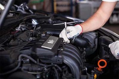 Car mechanic inspecting — Full service auto repair shop in Bellingham, WA