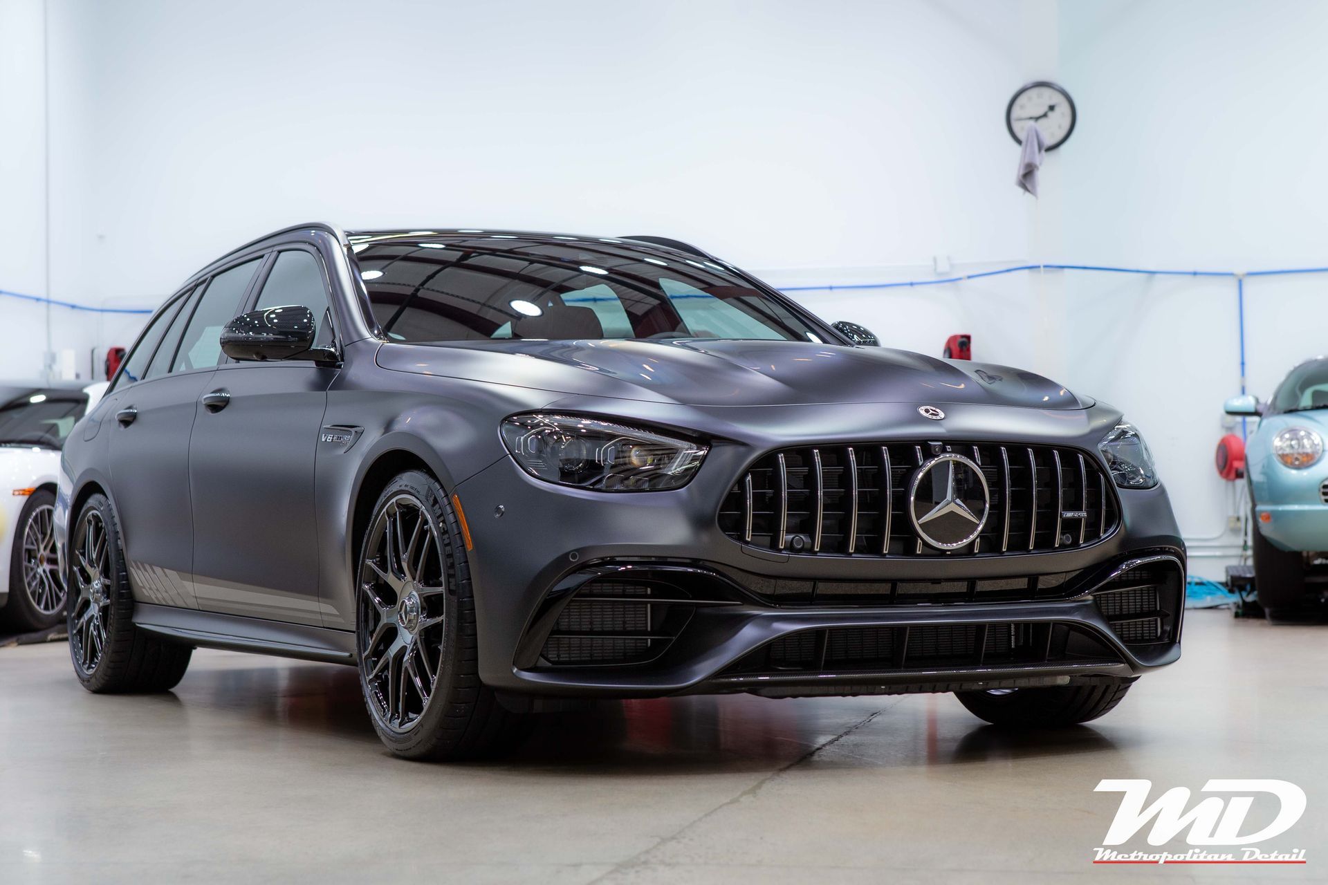A picture of a dark grey matte Mercedes AMG E63 S fully wrapped in STEK DYNOmatte.