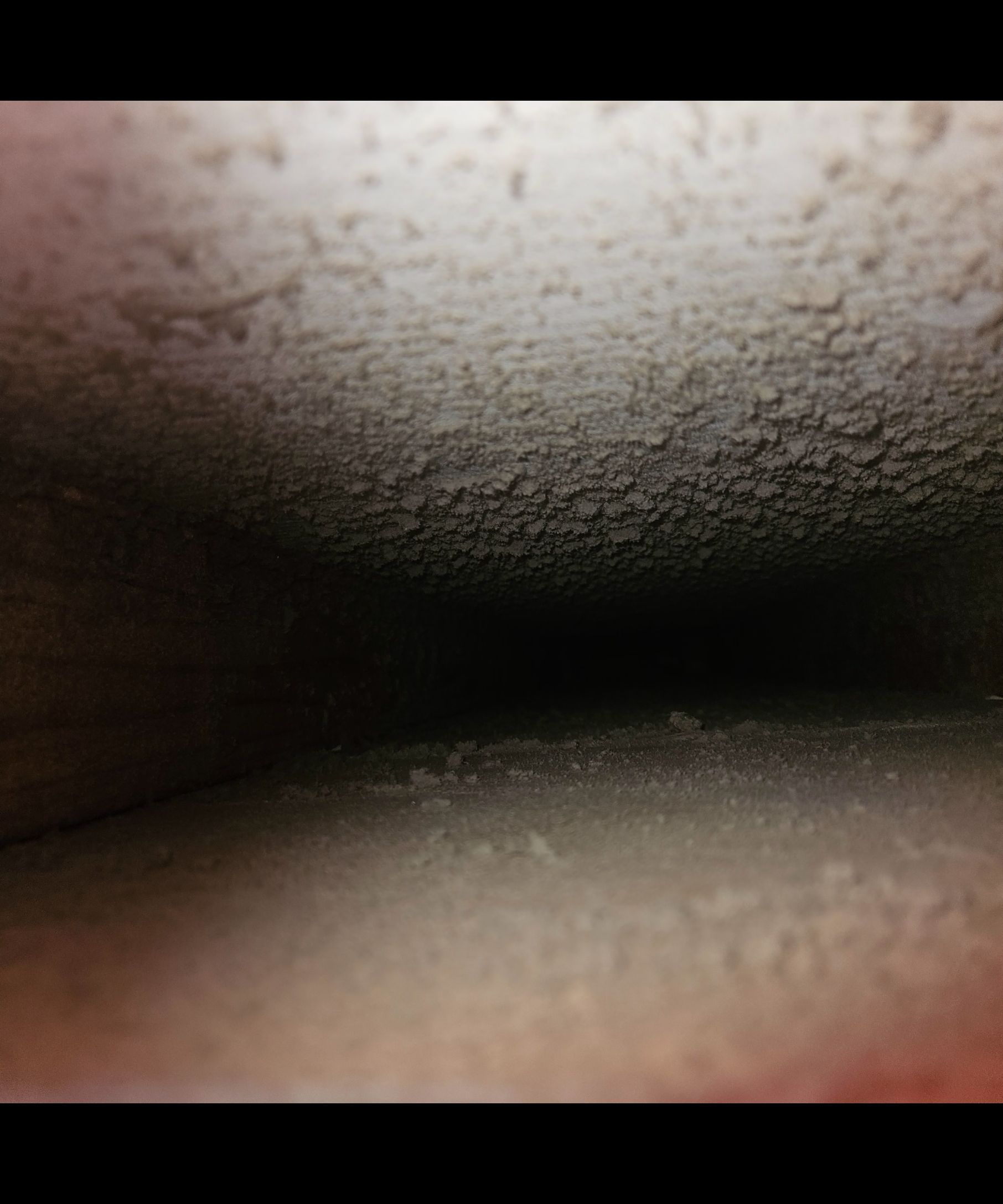 A close up of a wall with a lot of dust on it.