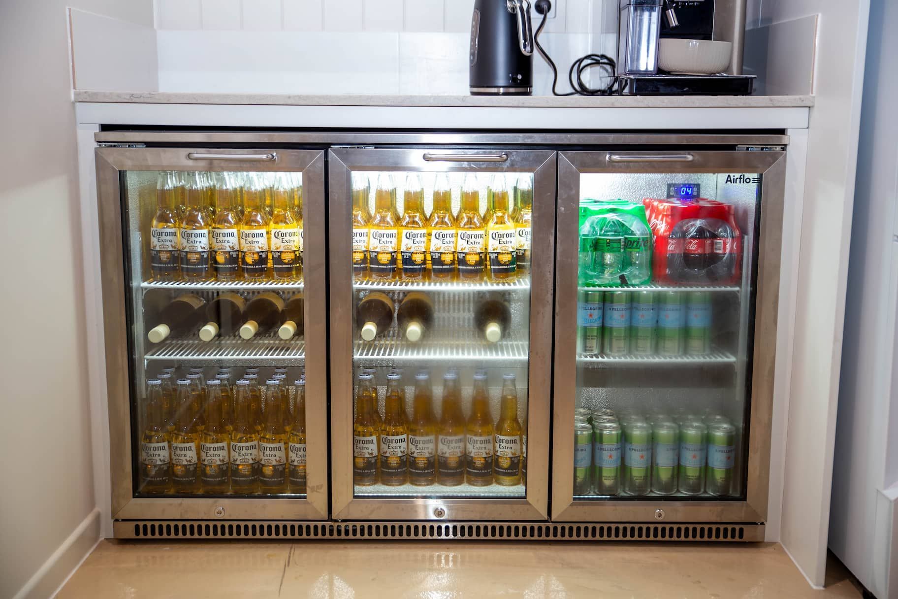 Bar fridge stocked with drinks