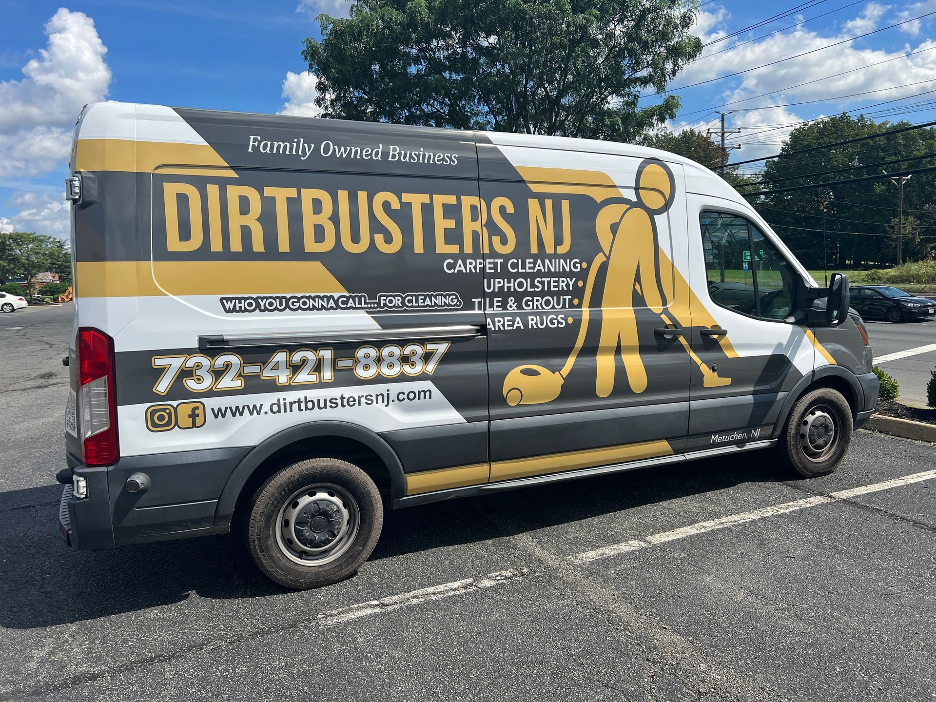 A dirtbusters van is parked in a parking lot.