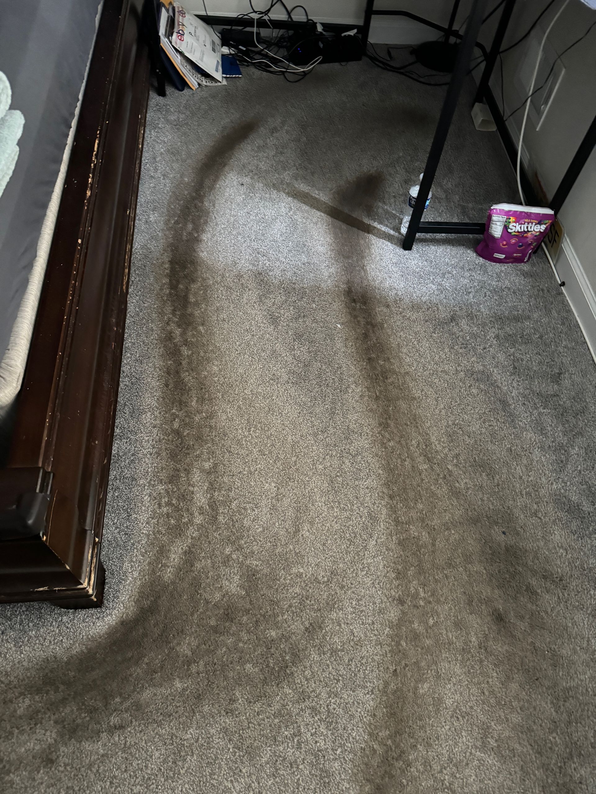 A close up of a carpet with stains on it.