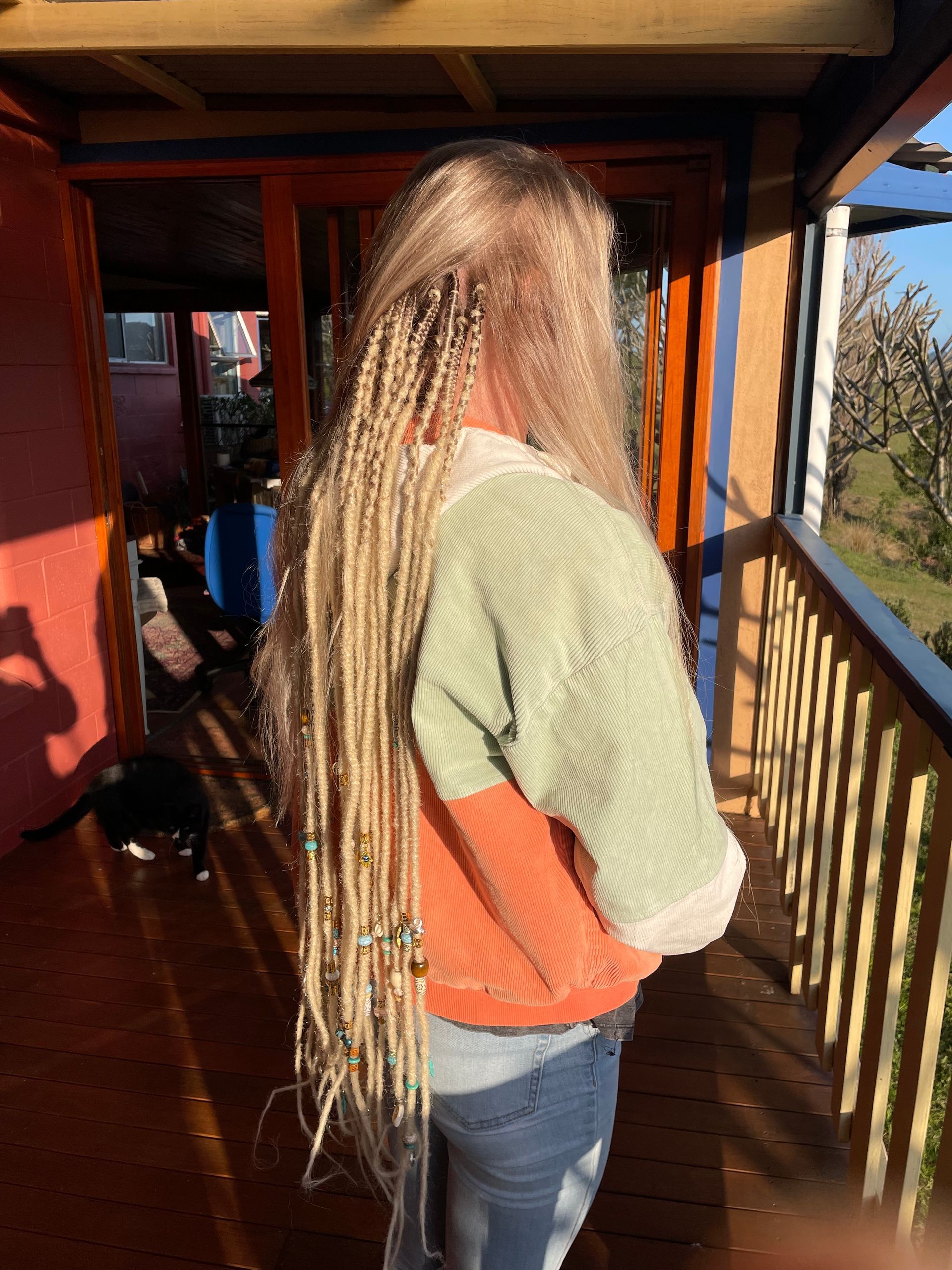 extra long blonde braided in temporary dreadlocks, nordic style, dread beads and accessories, braiding detail