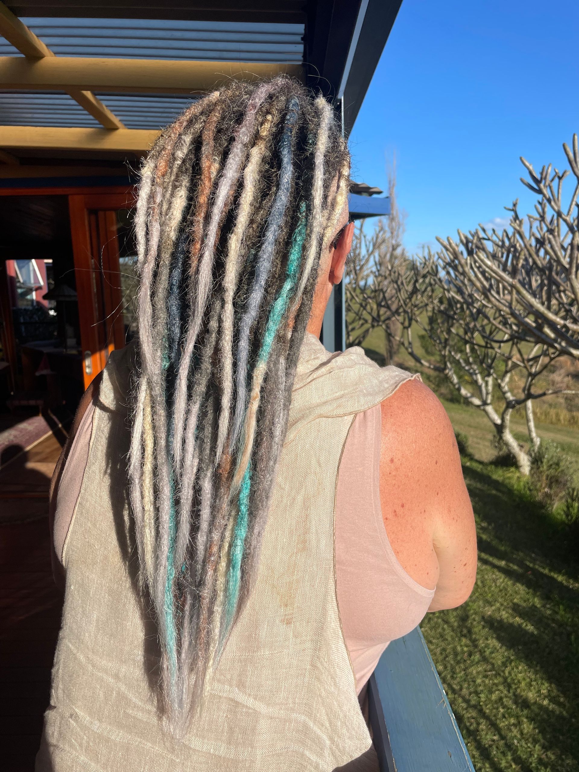 grey and blue coloured dread extensions, dreadlock mohawk style