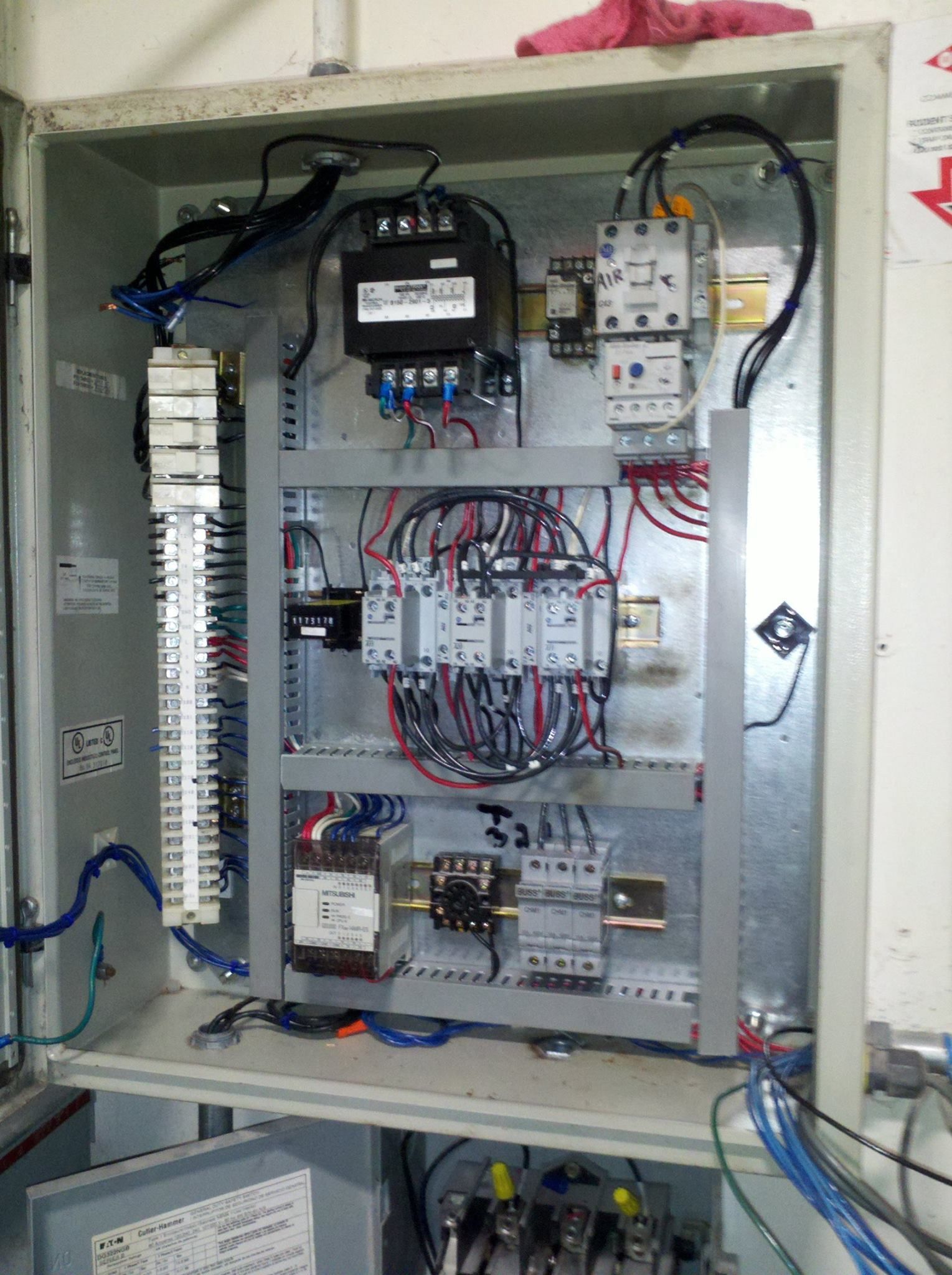 A electrical box with a lot of wires coming out of it