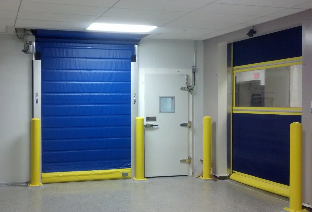 A room with a blue door and a white door