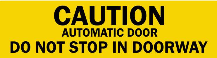 A yellow sign that says caution automatic door do not stop in doorway