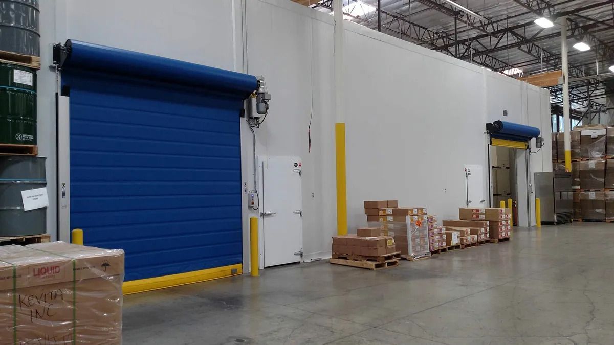 A large warehouse filled with lots of boxes and barrels.